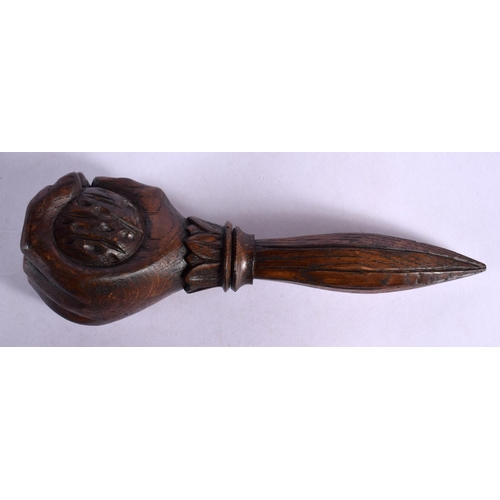 351 - A LATE 19TH CENTURY EUROPEAN CARVED WOOD FIST NUT CRACKER of tapering form. 15.5 cm wide.