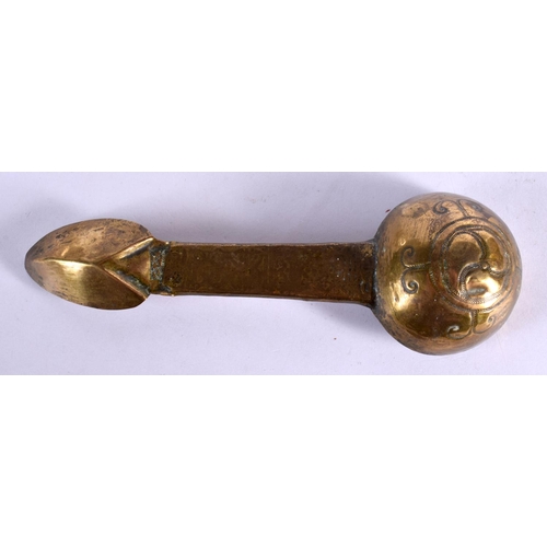 357 - AN UNUSUAL EARLY MIDDLE EASTERN ISLAMIC GILT METAL SPOON engraved with motifs. 21 cm long.