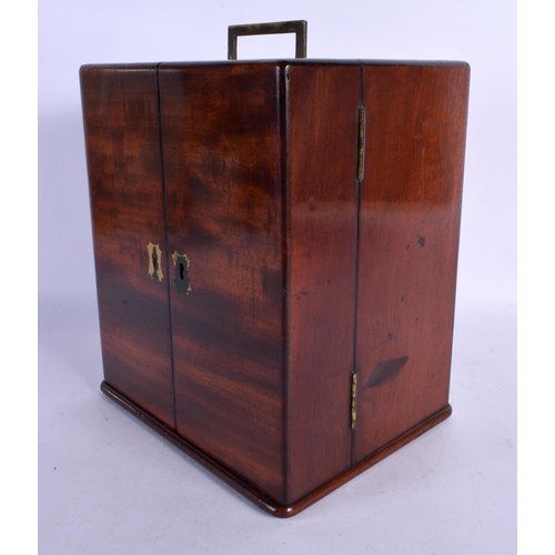 365 - AN EARLY VICTORIAN MAHOGANY APOTHECARY CASED SET the doors opening to reveal bottles. 24 cm x 18 cm.