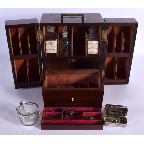 365 - AN EARLY VICTORIAN MAHOGANY APOTHECARY CASED SET the doors opening to reveal bottles. 24 cm x 18 cm.