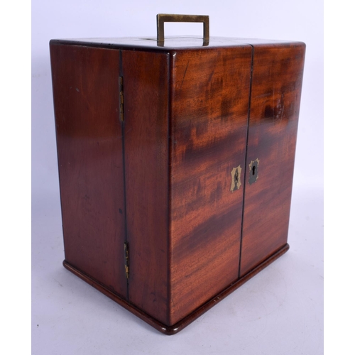 365 - AN EARLY VICTORIAN MAHOGANY APOTHECARY CASED SET the doors opening to reveal bottles. 24 cm x 18 cm.