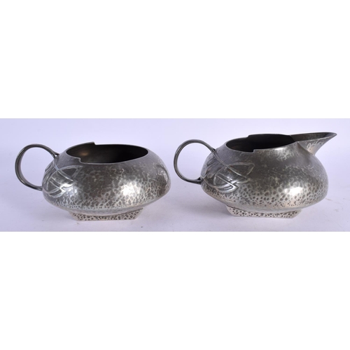 373 - AN ARTS AND CRAFTS STYLE ENGLISH PEWTER TEASET with tray, decorated with scrolling foliage. Largest ... 