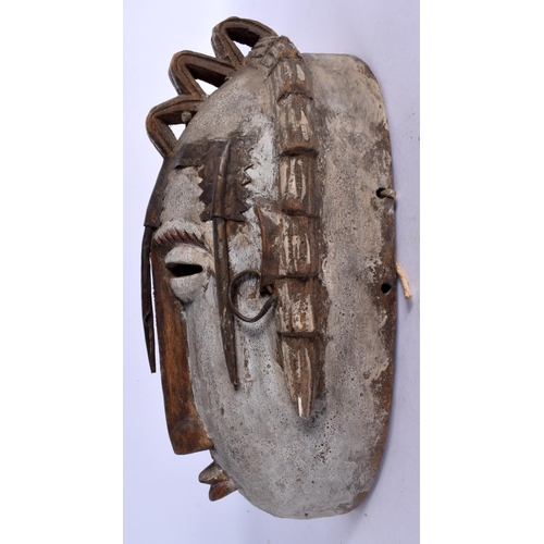 397 - A VINTAGE AFRICAN TRIBAL CARVED WOOD MASK. 32 cm x 15 cm.