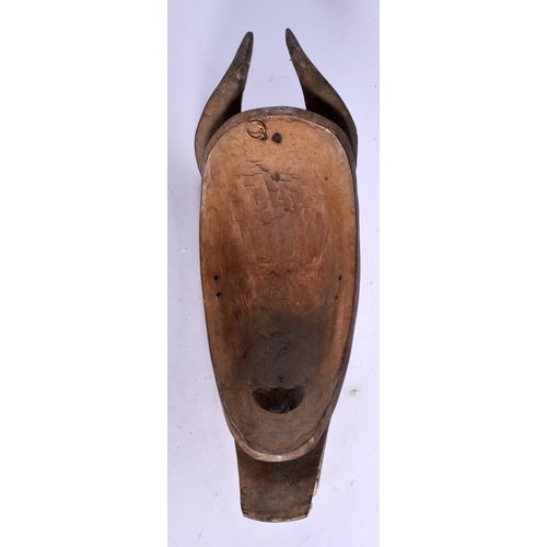 398 - A VINTAGE AFRICAN TRIBAL CARVED WOOD MASK. 34 cm x 10 cm.