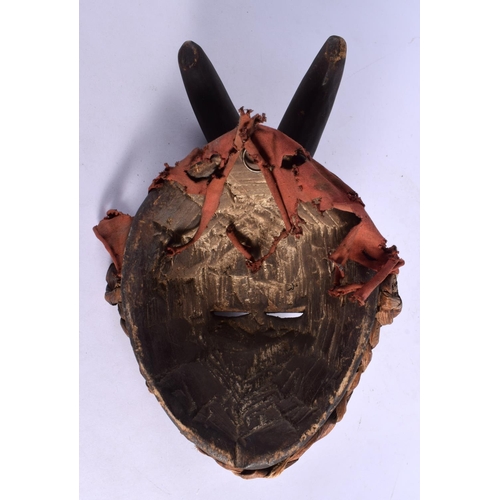 401 - A VINTAGE AFRICAN TRIBAL CARVED WOOD MASK. 38 cm x 15 cm.