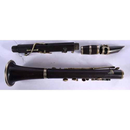 408 - A LOVELY ANTIQUE CARVED WOOD CLARINET within a George III wood case. 66 cm long.