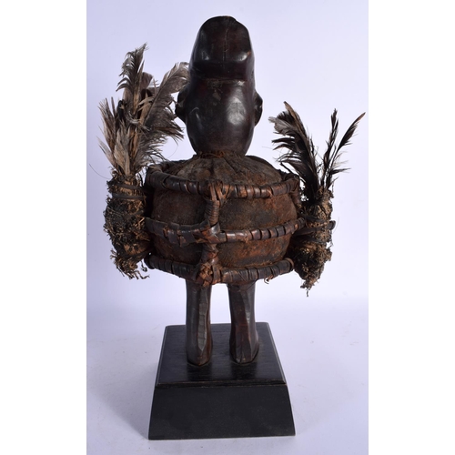 409 - A LARGE EARLY 20TH CENTURY AFRICAN TRIBAL CARVED WOOD FERTILITY FIGURE modelled with attached feathe... 