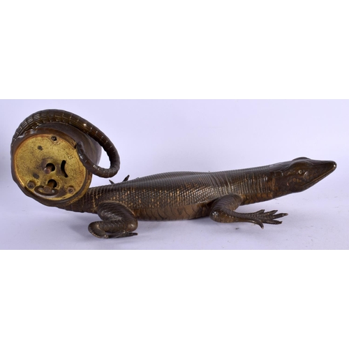 414 - A RARE NOVELTY LIZARD SCROLLING MANTEL CLOCK of naturalistic form. 24 cm x 10 cm.