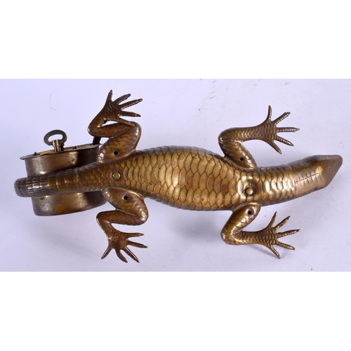 414 - A RARE NOVELTY LIZARD SCROLLING MANTEL CLOCK of naturalistic form. 24 cm x 10 cm.