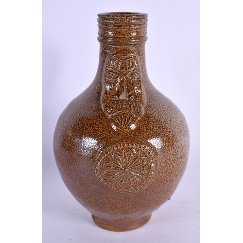 428 - AN ANTIQUE STONEWARE BELLARMINE JUG. 17 cm high.