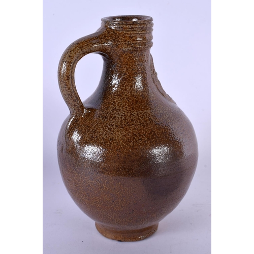 428 - AN ANTIQUE STONEWARE BELLARMINE JUG. 17 cm high.