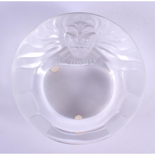 43 - A FRENCH LALIQUE GLASS ASHTRAY formed with a lion. 14 cm diameter.