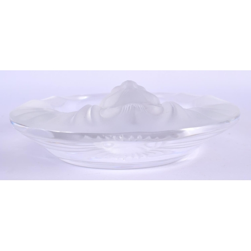 43 - A FRENCH LALIQUE GLASS ASHTRAY formed with a lion. 14 cm diameter.