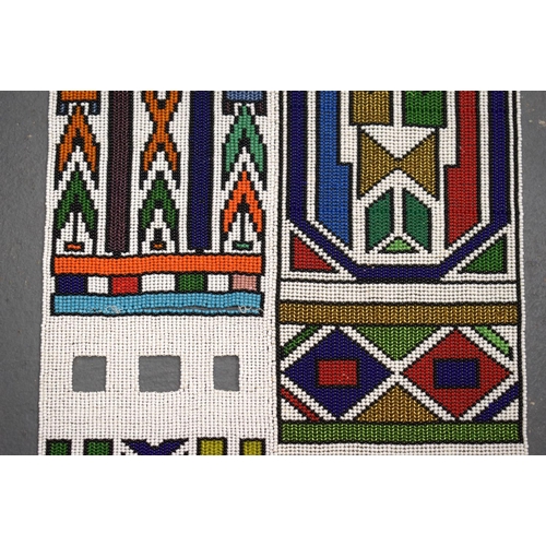 438 - AN AFRICAN BEADWORK TRIBAL SASH. 175 cm x 32 cm.