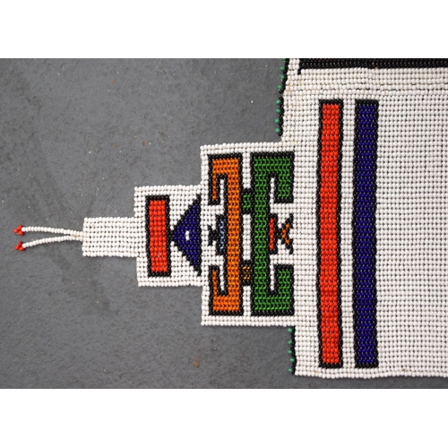 438 - AN AFRICAN BEADWORK TRIBAL SASH. 175 cm x 32 cm.