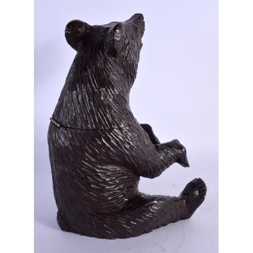 446 - AN EARLY 20TH CENTURY BAVARIAN BLACK FOREST BEAR TOBACCO JAR. 23.5 cm high.