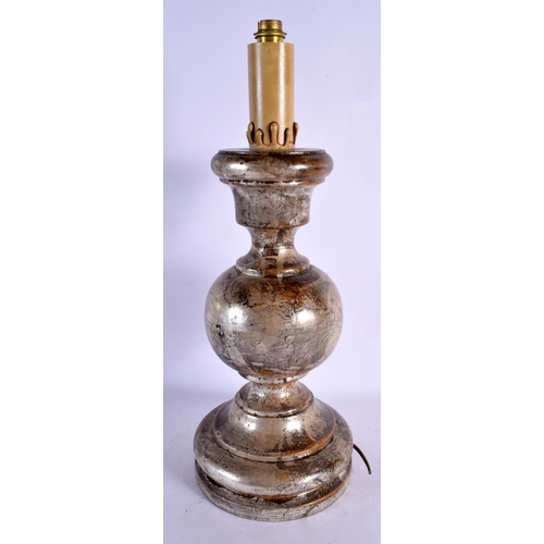 451 - A LARGE CONTINENTAL SILVERED WOOD CANDLESTICK LAMP. 48 cm high.