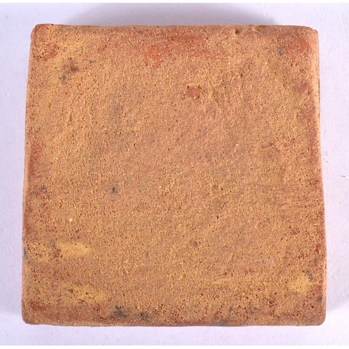 457 - AN ANTIQUE CONTINENTAL POTTERY TILE. 9.5 cm square.