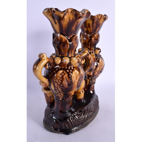 463 - A TURKISH MIDDLE EASTERN CANAKKALE POTTERY VASE STAND of naturalistic form. 23 cm x 18 cm.