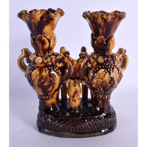 463 - A TURKISH MIDDLE EASTERN CANAKKALE POTTERY VASE STAND of naturalistic form. 23 cm x 18 cm.