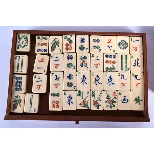 465 - AN EARLY 20TH CENTURY CHINESE CARVED BONE MAHJONG SET. 25 cm x 18 cm.