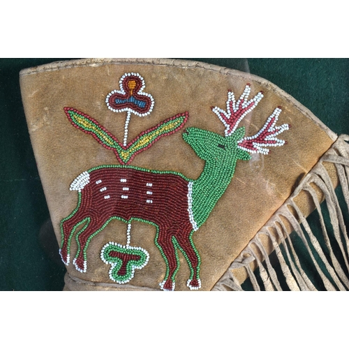 468 - A RARE EARLY 20TH CENTURY NORTH AMERICAN TRIBAL BEADWORK GLOVE decorated with reindeer and flowers. ... 