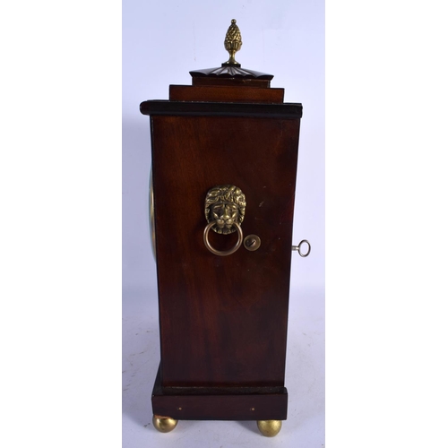 469 - A REGENCY JOHN GRAHAM OF LONDON MANTEL CLOCK decorated with brass motifs. 40 cm x 22 cm.