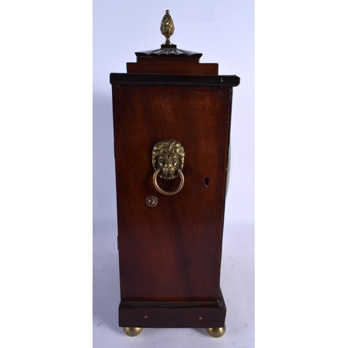 469 - A REGENCY JOHN GRAHAM OF LONDON MANTEL CLOCK decorated with brass motifs. 40 cm x 22 cm.