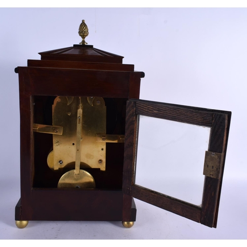 469 - A REGENCY JOHN GRAHAM OF LONDON MANTEL CLOCK decorated with brass motifs. 40 cm x 22 cm.