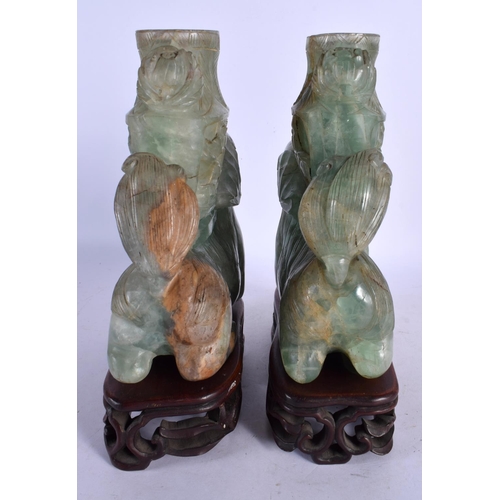 470 - A LARGE PAIR OF 19TH CENTURY CHINESE GREEN QUARTZ STONE FIGURES modelled as buddhistic lions. 24 cm ... 