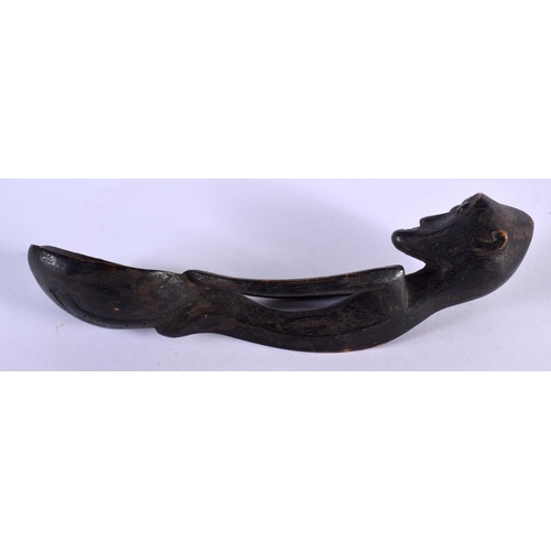 476 - AN AFRICAN TRIBAL CARVED WOOD SPOON. 17 cm long.