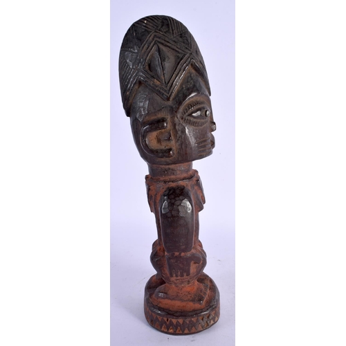 477 - AN AFRICAN TRIBAL CARVED WOOD FIGURE. 27 cm high.