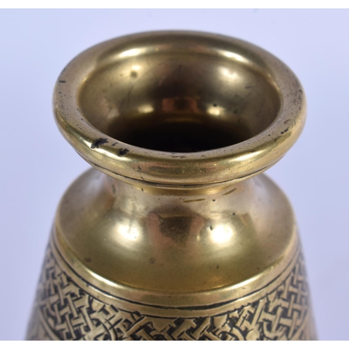 491 - AN 18TH CENTURY ISLAMIC MIDDLE EASTERN BRONZE VASE decorated with Kufic script. 20 cm high.