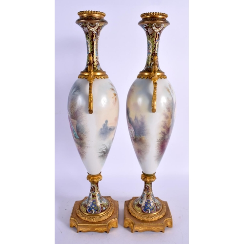 53 - A LARGE LATE 19TH CENTURY FRENCH SEVRES PORCELAIN VASES with champleve enamel mounts. 39 cm high.