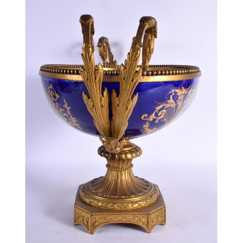 555 - A VERY LARGE 19TH CENTURY FRENCH ORMOLU AND SEVRES PORCELAIN CENTRE PIECE painted with figures in la... 