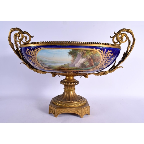 555 - A VERY LARGE 19TH CENTURY FRENCH ORMOLU AND SEVRES PORCELAIN CENTRE PIECE painted with figures in la... 