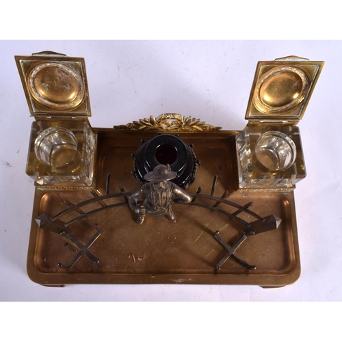 593 - AN ANTIQUE BRONZE AND GILT METAL DESK STAND. 30 cm x 18 cm.