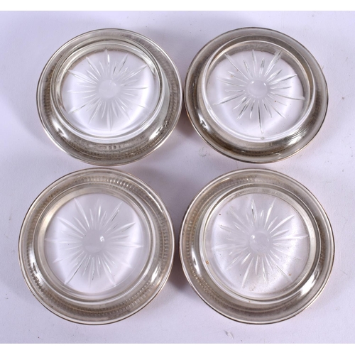 604 - FOUR CONTINENTAL SILVER MOUNTED DISHES. 651 grams. 9.5 cm diameter. (4)