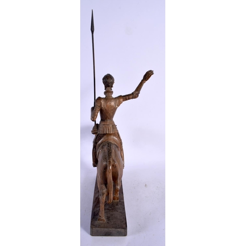 608 - A VINTAGE CARVED WOOD FIGURE OF A MALE UPON A HORSE. 45 cm high.