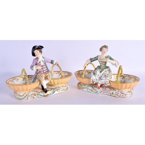 61 - A PAIR OF 19TH CENTURY EUROPEAN TWIN HANDLED PORCELAIN TABLE SALTS modelled as figures upon baskets.... 