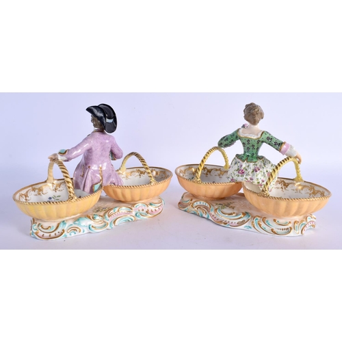 61 - A PAIR OF 19TH CENTURY EUROPEAN TWIN HANDLED PORCELAIN TABLE SALTS modelled as figures upon baskets.... 