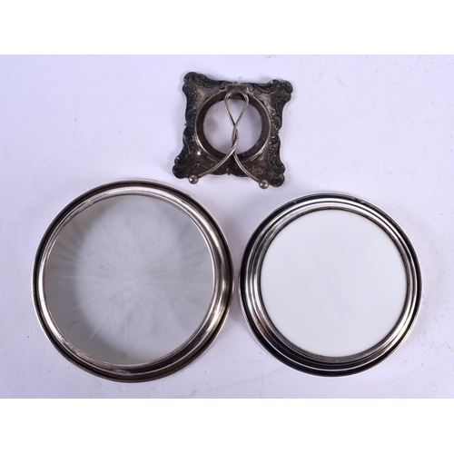 617 - TWO SILVER COASTERS and a mini silver frame. 200 grams overall. (3)