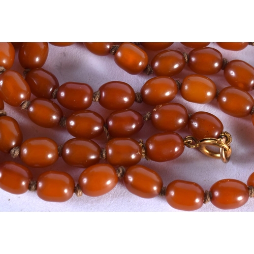 632 - AN AMBER TYPE NECKLACE.  Length 36cm, largest bead 8.8mm, weight 16.1g