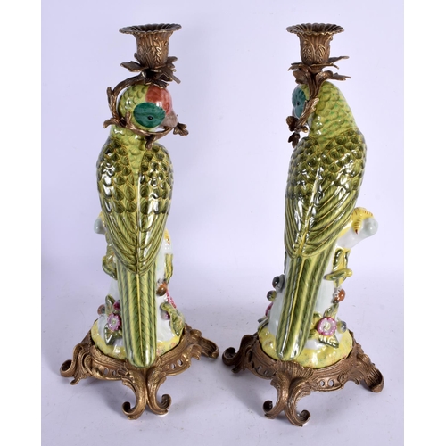 650 - A LARGE PAIR OF CONTEMPORARY PARROT CANDLESTICKS. 36 cm high.