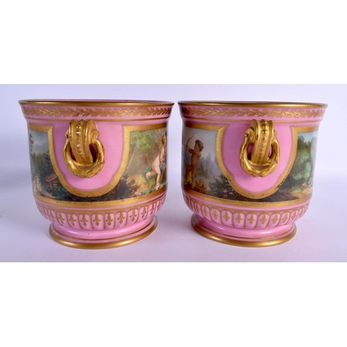 68 - A PAIR OF 19TH CENTURY FRENCH PARIS PORCELAIN JARDINIERES painted with putti in various pursuits. 20... 