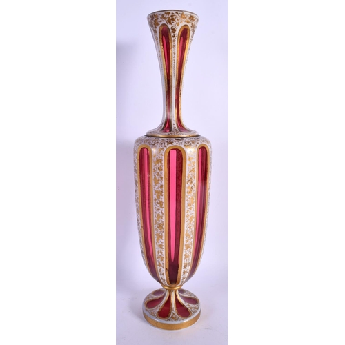 69 - A LATE 19TH CENTURY BOHEMIAN GLASS VASE painted with gilt foliage and vines. 38 cm high.