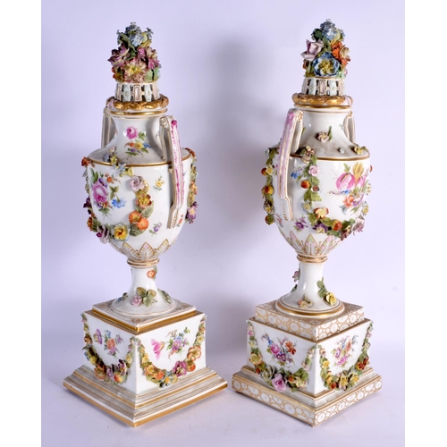 70 - A PAIR OF LATE 19TH CENTURY GERMAN DRESDEN PORCELAIN VASES AND COVERS painted with landscapes. 47 cm... 