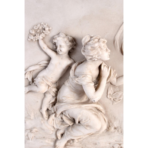 71 - A CLASSICAL PLAQUE decorated with putti. 34 cm x 20 cm.