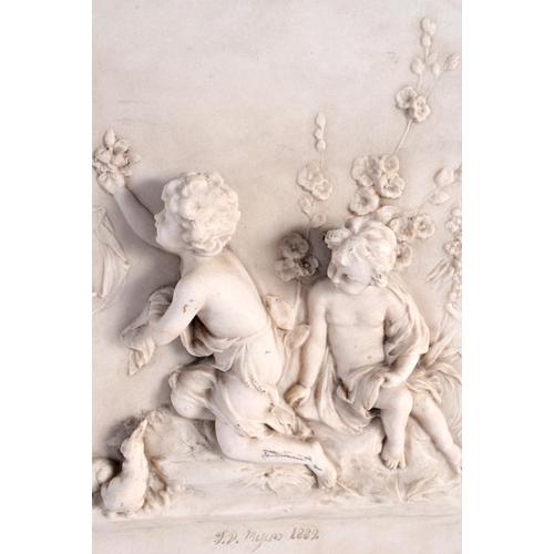 71 - A CLASSICAL PLAQUE decorated with putti. 34 cm x 20 cm.