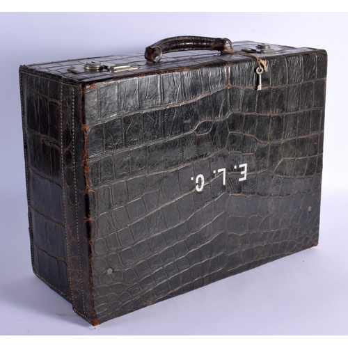 739 - A VINTAGE CROCODILE SUITCASE. 43 cm x 30 cm x 22 cm.